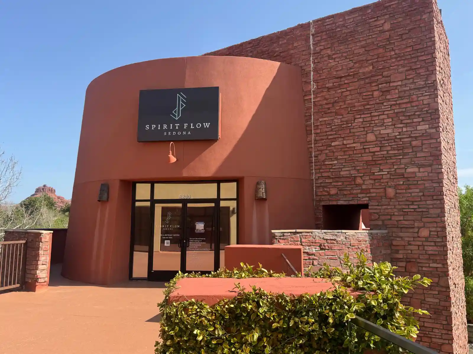 Card SFS at The Collective the building of SpiritFlow Sedona Healing and Retreat Center with views of Bell Rock in Sedona