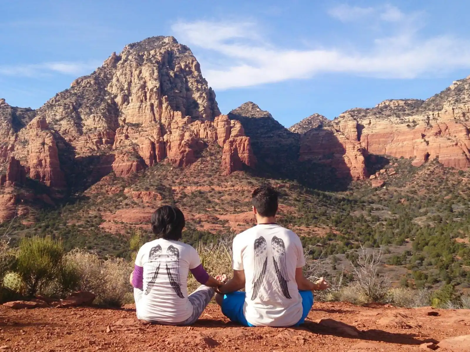 a couple meditating A couple meditating on the red rocks of Sedona